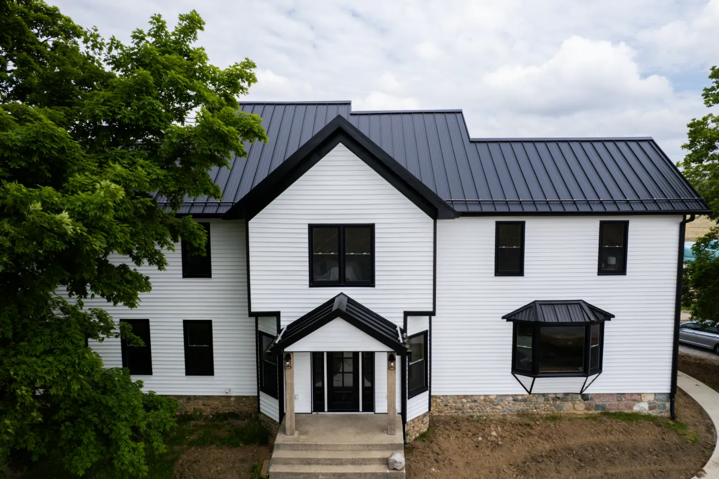 Siding installation documented in Springmill Villages